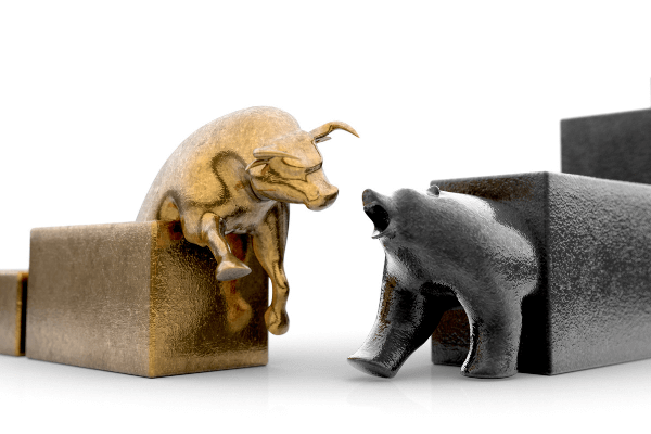 Nell'immagine un toro color oro, segno del mercato rialzista, sfida un orso. I due animali escono da dei blocchi in fila che segnano l'andamento del mercato